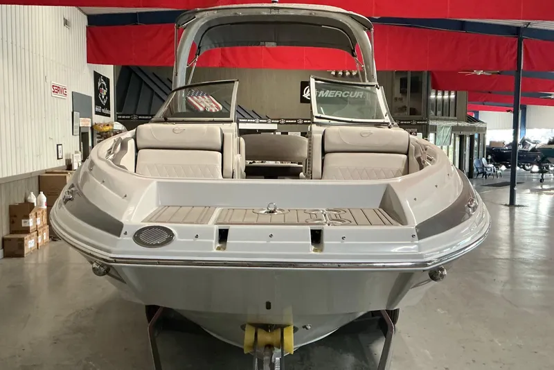 Slide: The Image of 2021 Crownline Eclipse E255 boat in showroom, rear view with seating and deck. - 23