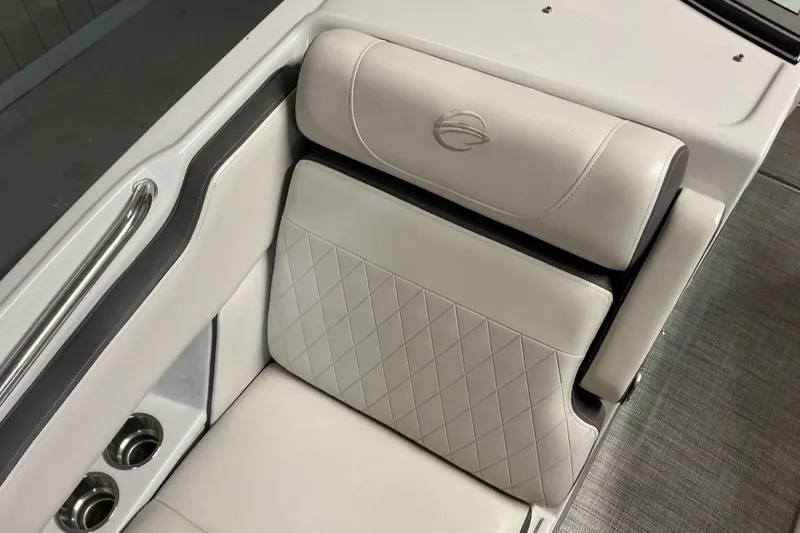 Slide: The Image of 2021 Crownline Eclipse E255 boat seat with diamond-stitched upholstery and cup holders. - 27