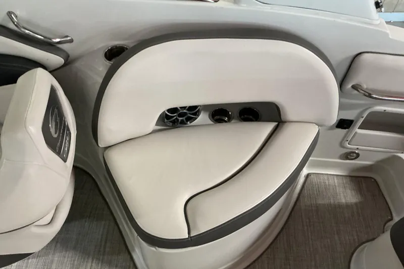 Slide: The Image of 2021 Crownline Eclipse E255 boat interior seating with cup holders and speaker. - 30
