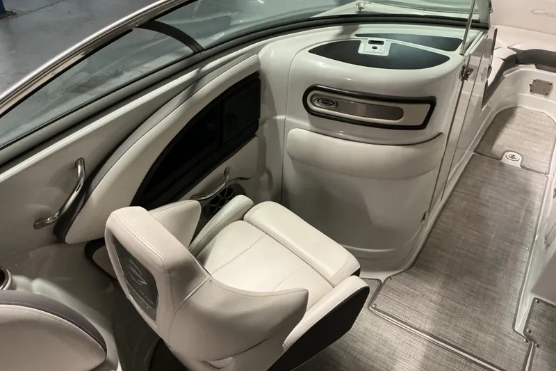 Slide: The Image of 2021 Crownline Eclipse E255 boat interior with sleek seating and modern dashboard design. - 31