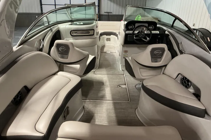 Slide: The Image of Interior of a 2021 Crownline Eclipse E255 boat with luxurious seating and modern dashboard. - 33