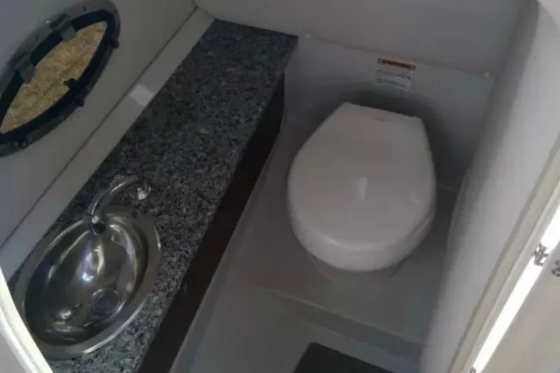 Slide: The Image of 2021 Crownline Eclipse E255 boat bathroom with sink and toilet. - 37