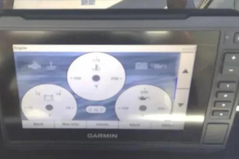 Slide: The Image of Garmin display on 2021 Crownline Eclipse E255 boat dashboard showing engine data. - 38