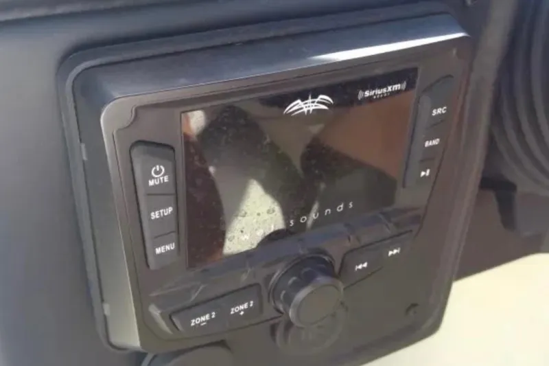 Slide: The Image of 2021 Crownline Eclipse E255 boat stereo system with SiriusXM and control buttons. - 39