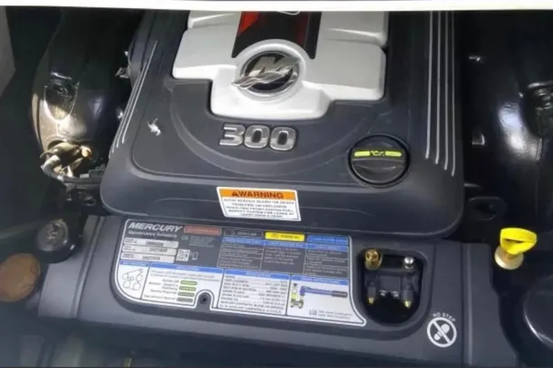 Slide: The Image of Engine compartment of a 2021 Crownline Eclipse E255 boat, featuring a Mercury 300 engine. - 41