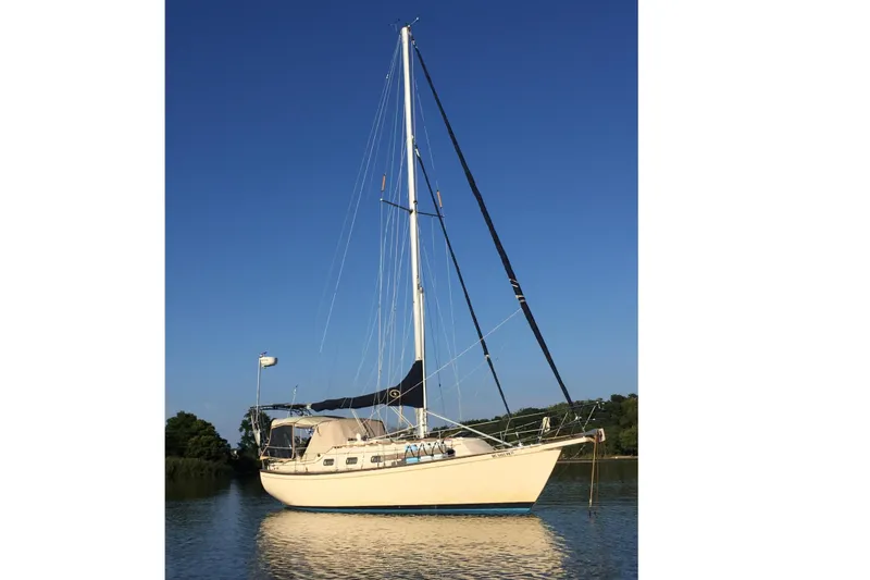 The Image of 1994 Island Packet 32 sailboat on calm water. - 0