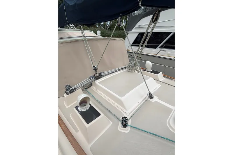 Slide: The Image of Deck view of a 1994 Island Packet 32 sailboat with rigging and hatch details. - 19