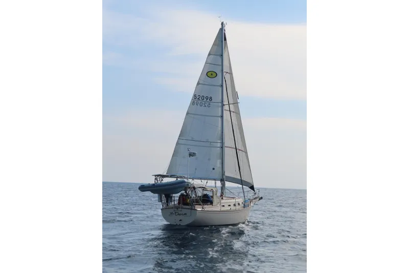 Slide: The Image of Sailing on open water, 1994 Island Packet 32 yacht with full sails. - 3