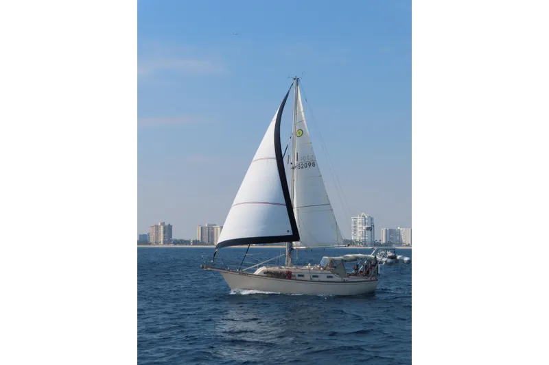 Slide: The Image of Sailboat Island Packet 32 (1994) cruising near city skyline on a sunny day. - 5