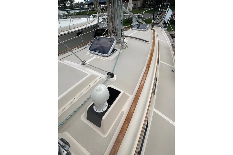 Slide: The Image of 1994 Island Packet 32 sailboat deck with hatches and rigging. - 15