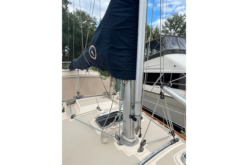 Slide: The Image of 1994 Island Packet 32 sailboat deck with rigging and mast details. - 18