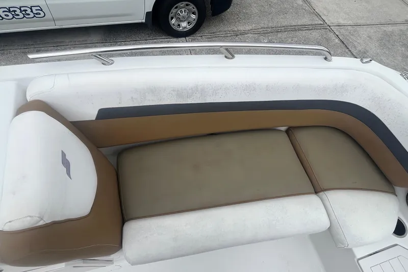 Slide: The Image of 2021 Starcraft SVX 211 OB boat seating with brown and white upholstery. - 11