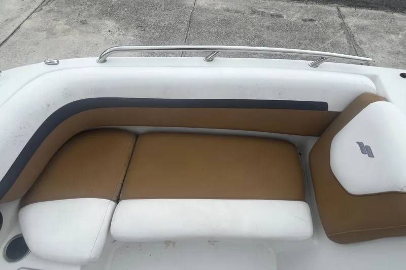 Slide: The Image of 2021 Starcraft SVX 211 OB boat seating with brown and white upholstery. - 13