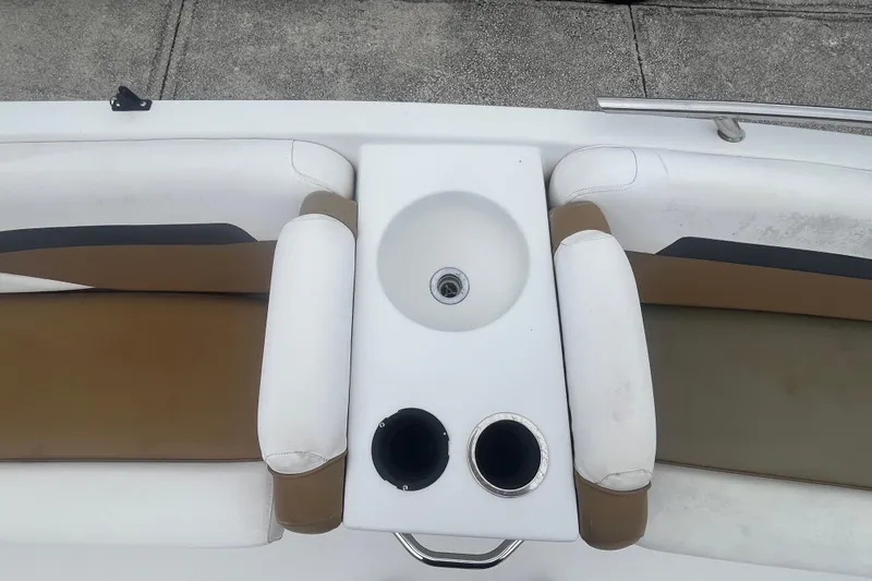 Slide: The Image of 2021 Starcraft SVX 211 OB boat interior with seating and built-in sink. - 15