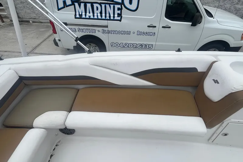 Slide: The Image of 2021 Starcraft SVX 211 OB boat interior with tan and white seating. - 18