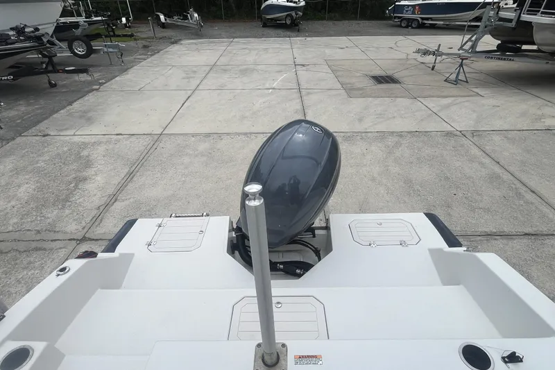 Slide: The Image of 2021 Starcraft SVX 211 OB boat with outboard motor in a marina setting. - 20