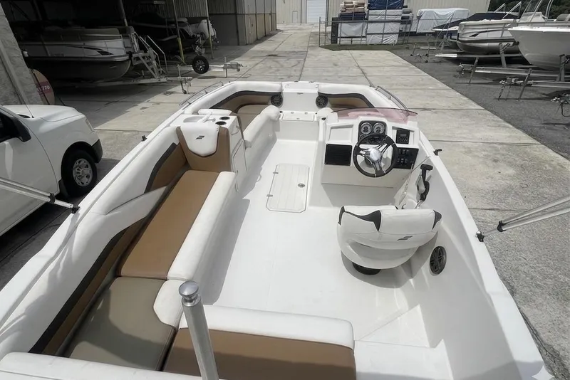 Slide: The Image of 2021 Starcraft SVX 211 OB boat interior with seating and steering console. - 22