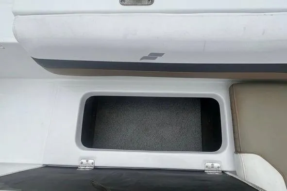 Slide: The Image of Storage compartment on a 2021 Starcraft SVX 211 OB boat, featuring a sleek design. - 25