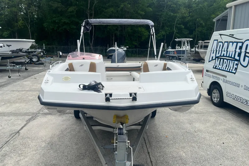 Slide: The Image of 2021 Starcraft SVX 211 OB boat on trailer at marine service center. - 6