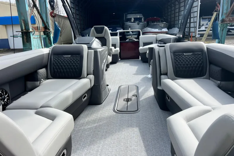 Slide: The Image of Luxurious interior of 2026 Harris Sunliner 230 pontoon boat with plush seating. - 11