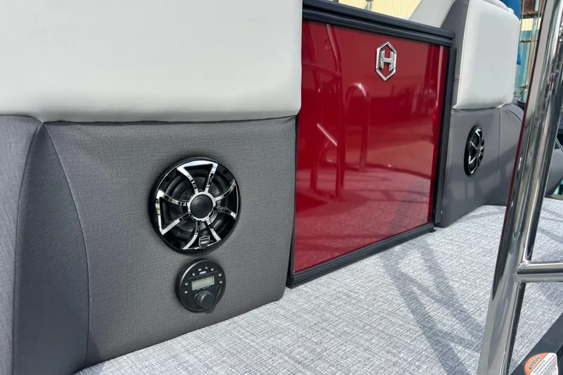 Slide: The Image of 2026 Harris Sunliner 230 interior with speaker and red panel detail. - 13