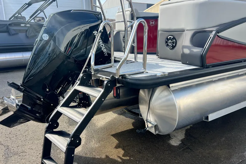 Slide: The Image of 2026 Harris Sunliner 230 pontoon boat with Mercury outboard motor and boarding ladder. - 17