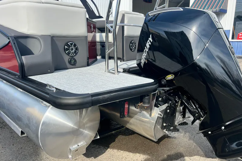 Slide: The Image of 2026 Harris Sunliner 230 pontoon boat with Mercury outboard motor, rear deck view. - 18