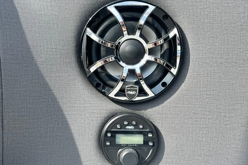 Slide: The Image of Speaker and control panel on 2026 Harris Sunliner 230 boat interior. - 20