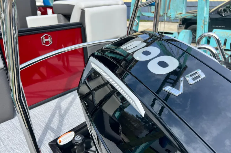 Slide: The Image of 2026 Harris Sunliner 230 boat interior with V8 engine detail. - 8