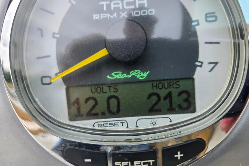 Slide: The Image of Tachometer of 2011 Sea Ray 200 Sundeck showing 12 volts and 213 hours. - 17
