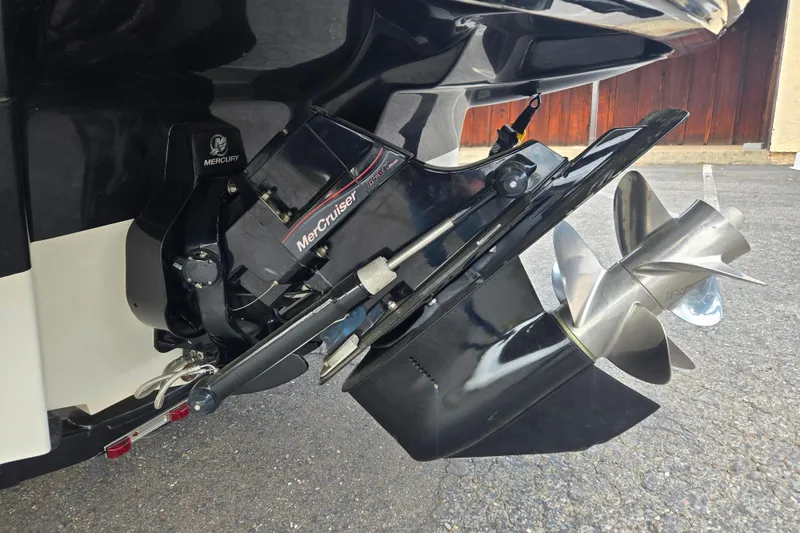 Slide: The Image of Close-up of a 2011 Sea Ray 200 Sundeck MerCruiser engine and propeller. - 3