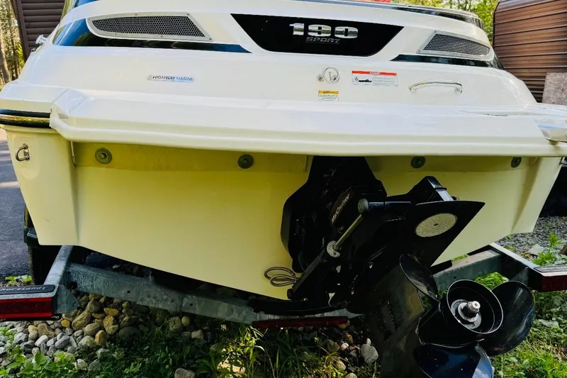 Slide: The Image of Rear view of a 2013 Sea Ray 190 Sport boat on a trailer. - 10