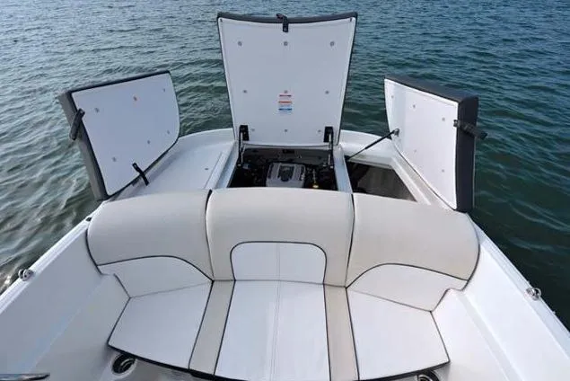 Slide: The Image of Manufacturer Provided Image: 2013 Sea Ray 190 Sport boat with open engine compartment on water. - 15