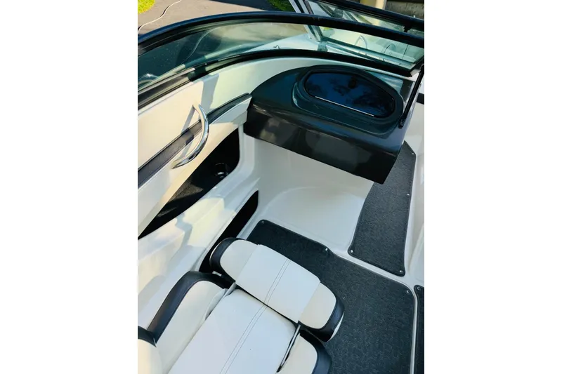 Slide: The Image of Interior of 2013 Sea Ray 190 Sport boat, featuring sleek seating and modern design. - 5