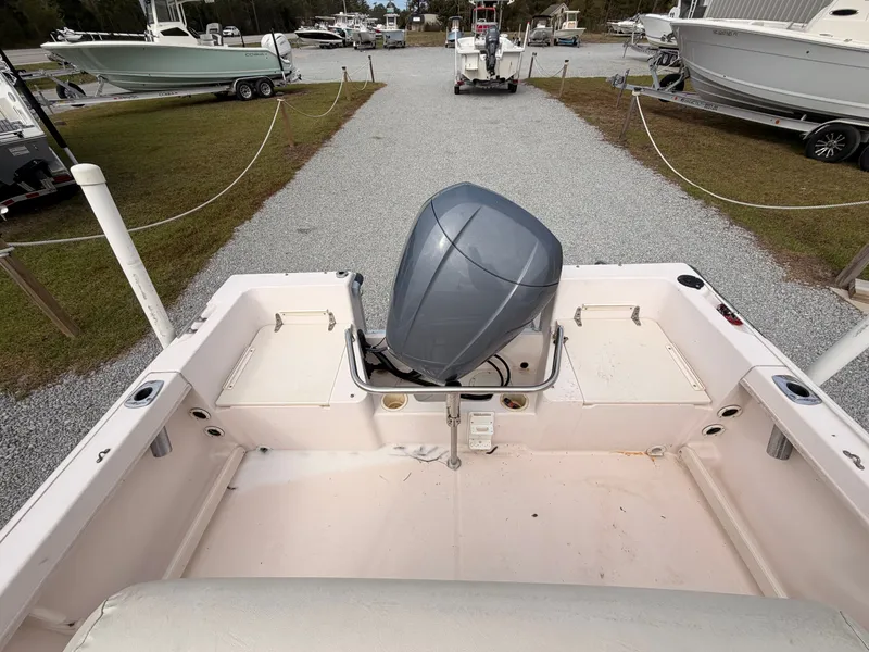 Slide: The Image of 1999 Grady-White Sportsman 180 boat with outboard motor on gravel path. - 14