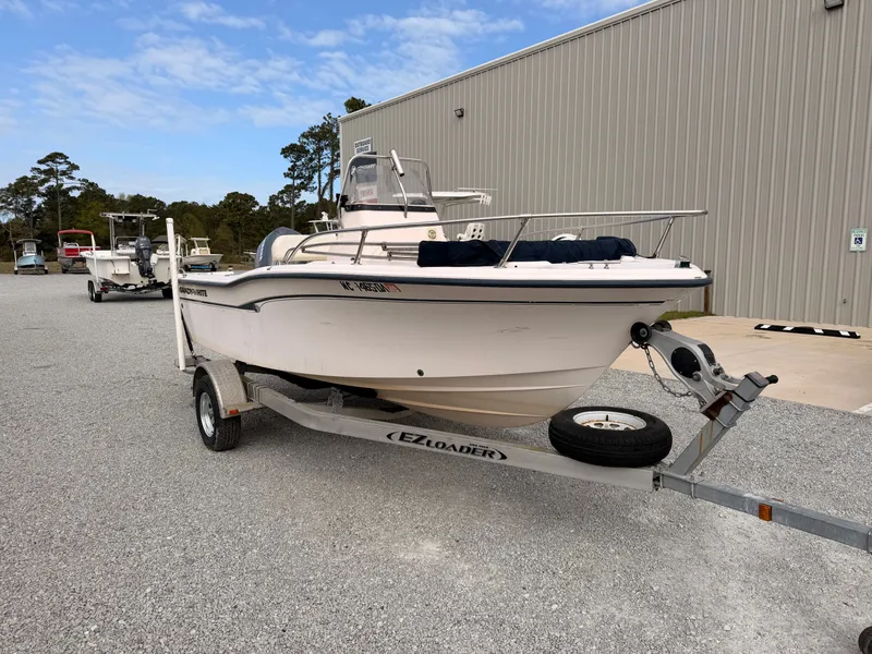 Slide: The Image of 1999 Grady-White Sportsman 180 boat on trailer outside warehouse. - 2