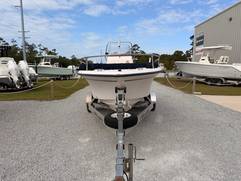 Slide: The Image of 1999 Grady-White Sportsman 180 boat on trailer, blue sky. - 3