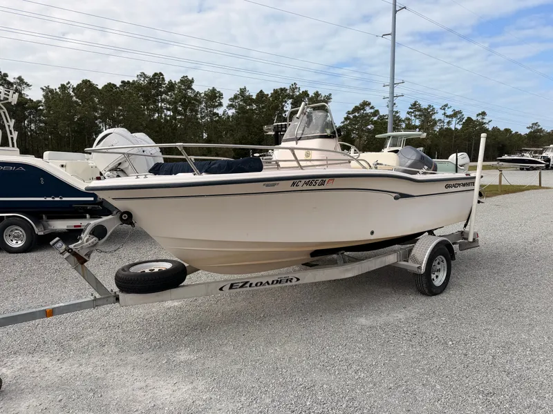 Slide: The Image of 1999 Grady-White Sportsman 180 boat on trailer outdoors. - 4
