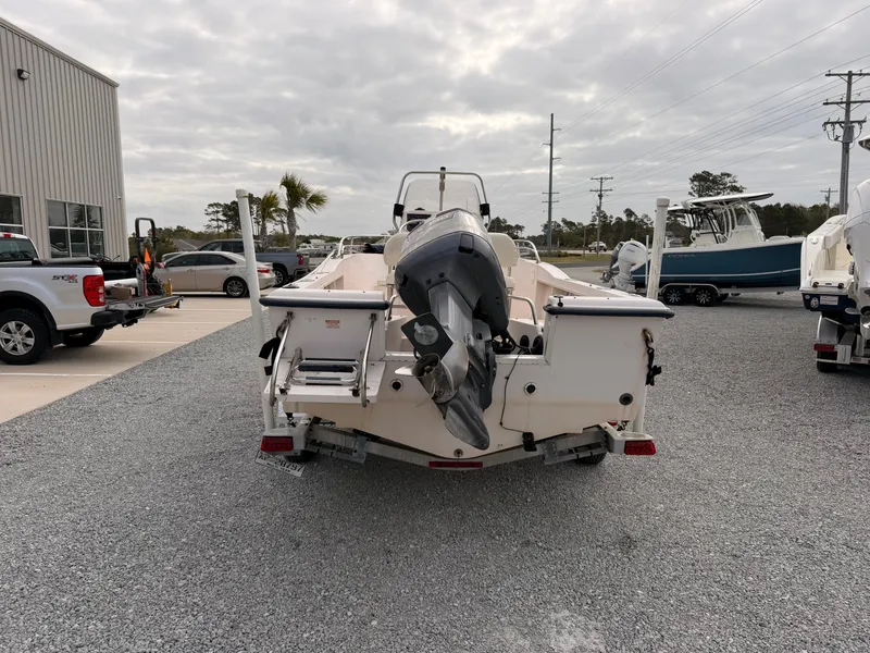 Slide: The Image of 1999 Grady-White Sportsman 180 boat parked on gravel lot. - 6