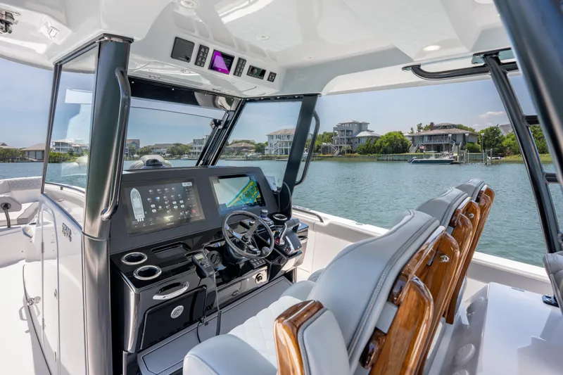 Slide: The Image of Interior view of 2026 Everglades 375 Center Console boat with advanced navigation system. - 9