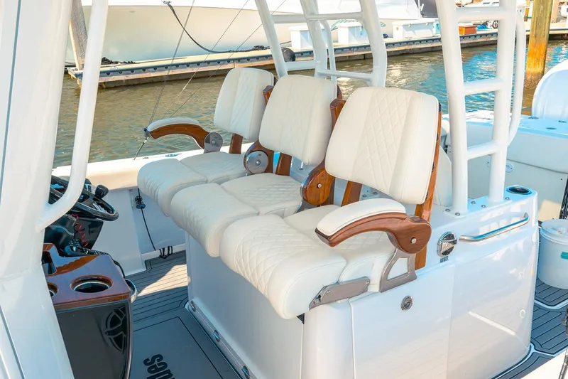 Slide: The Image of Manufacturer Provided Image: Luxury seating on 2026 Everglades 375 Center Console boat, docked by the water. - 12