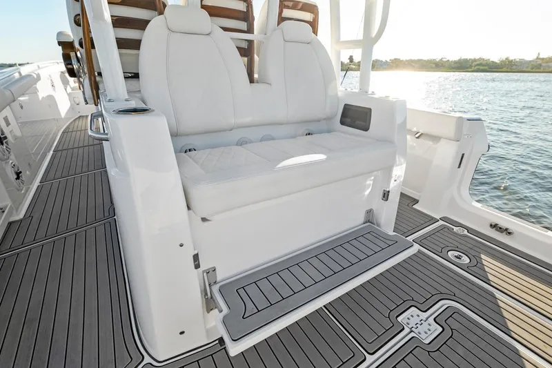 Slide: The Image of Luxury seating on 2026 Everglades 375 Center Console boat, overlooking serene waters. - 15