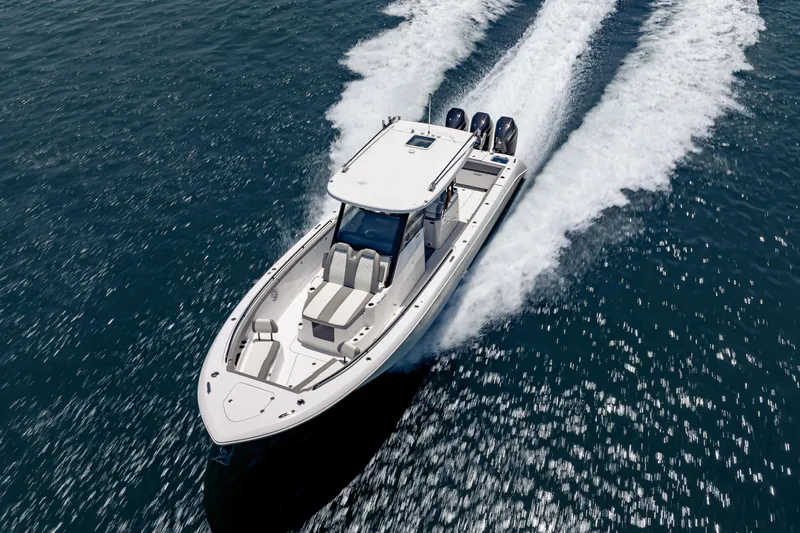 Slide: The Image of 2026 Everglades 375 Center Console boat cruising on open water, showcasing sleek design and performance. - 5