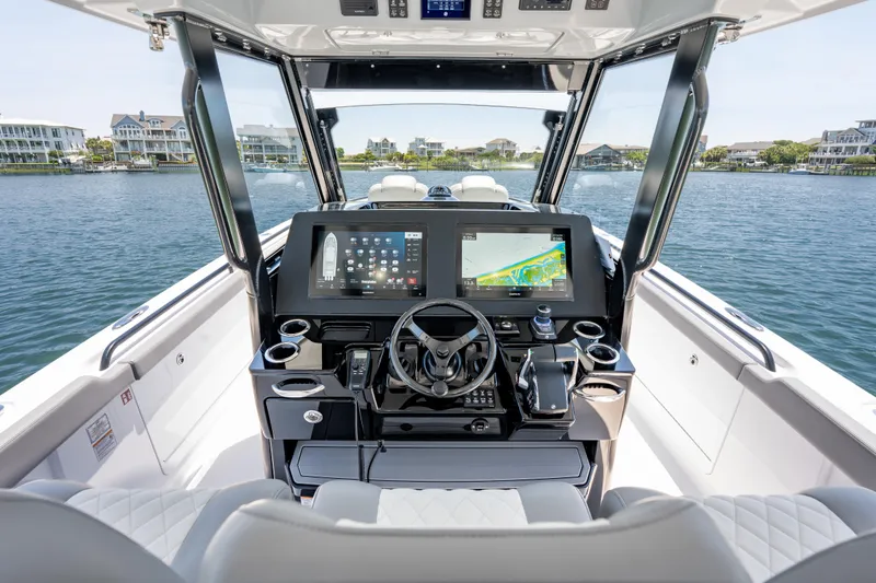 Slide: The Image of 2026 Everglades 375 Center Console boat interior with advanced navigation system and luxurious seating. - 10