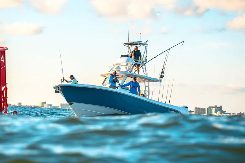 Slide: The Image of Manufacturer Provided Image: 2026 Everglades 375 Center Console boat with anglers on open water. - 3