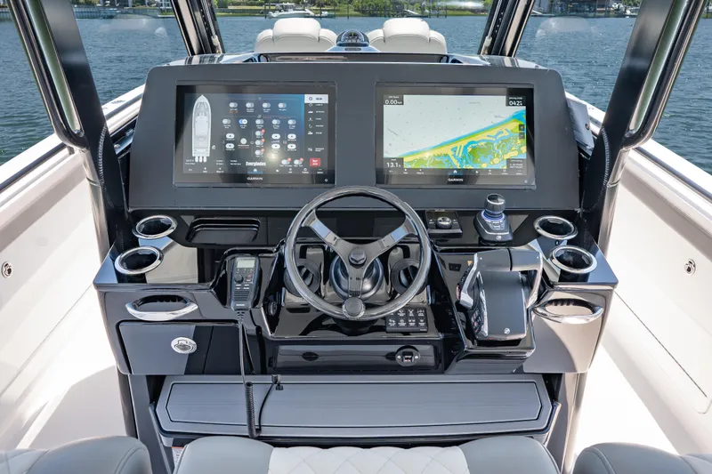 Slide: The Image of 2026 Everglades 375 Center Console boat dashboard with advanced navigation displays. - 11