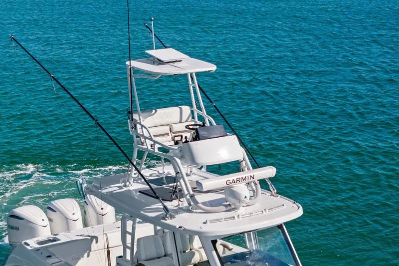 Slide: The Image of 2026 Everglades 375 Center Console boat on blue ocean water. - 8
