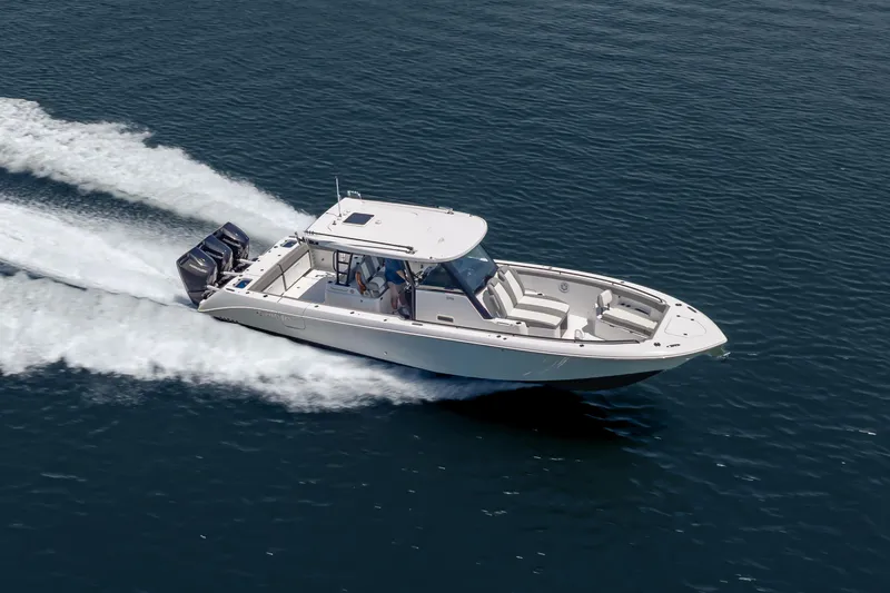 Slide: The Image of 2026 Everglades 375 Center Console boat cruising on open water. - 3