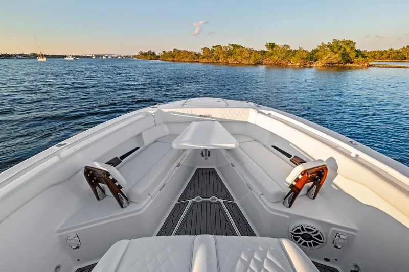 Slide: The Image of Luxurious 2026 Everglades 375 Center Console boat interior on serene water. - 9