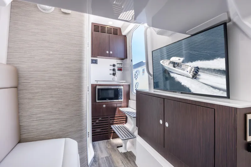 Slide: The Image of Interior of 2026 Everglades 375 Center Console boat with modern amenities and sleek design. - 22